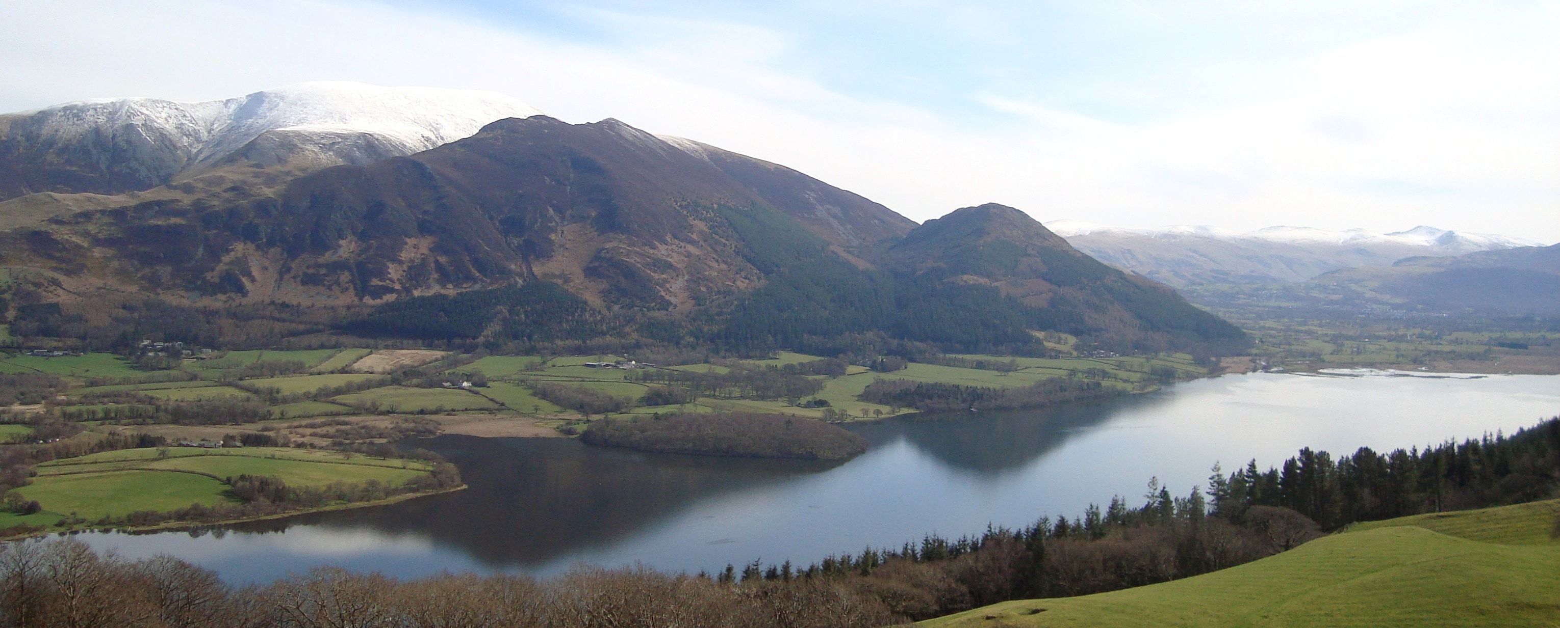 Bassenthwaite Lake laid out below the grassy slopes of Sale Fell