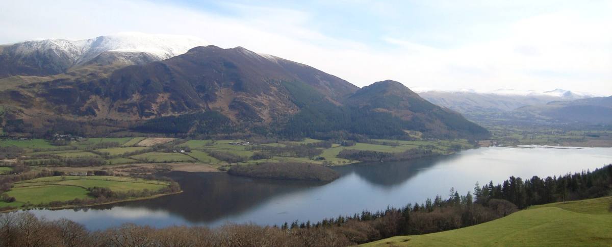 Bassenthwaite Lake laid out below the grassy slopes of Sale Fell