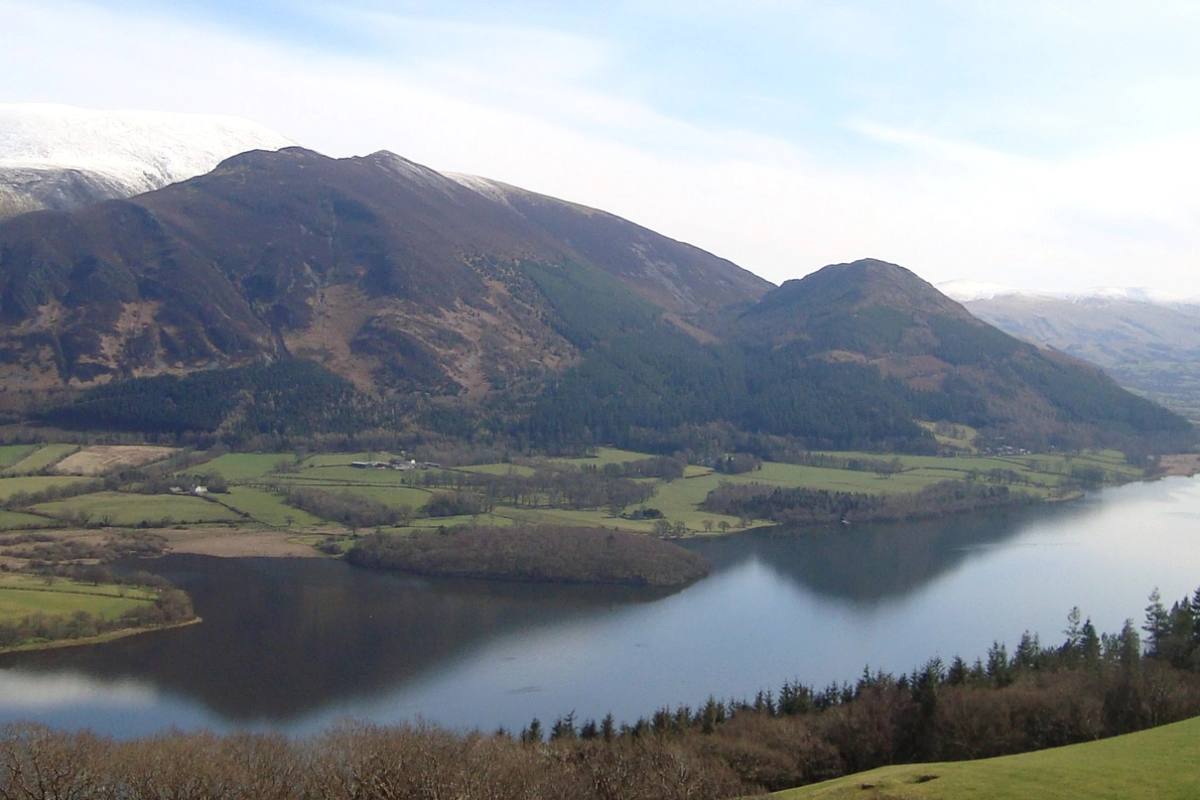Bassenthwaite Lake laid out below the grassy slopes of Sale Fell