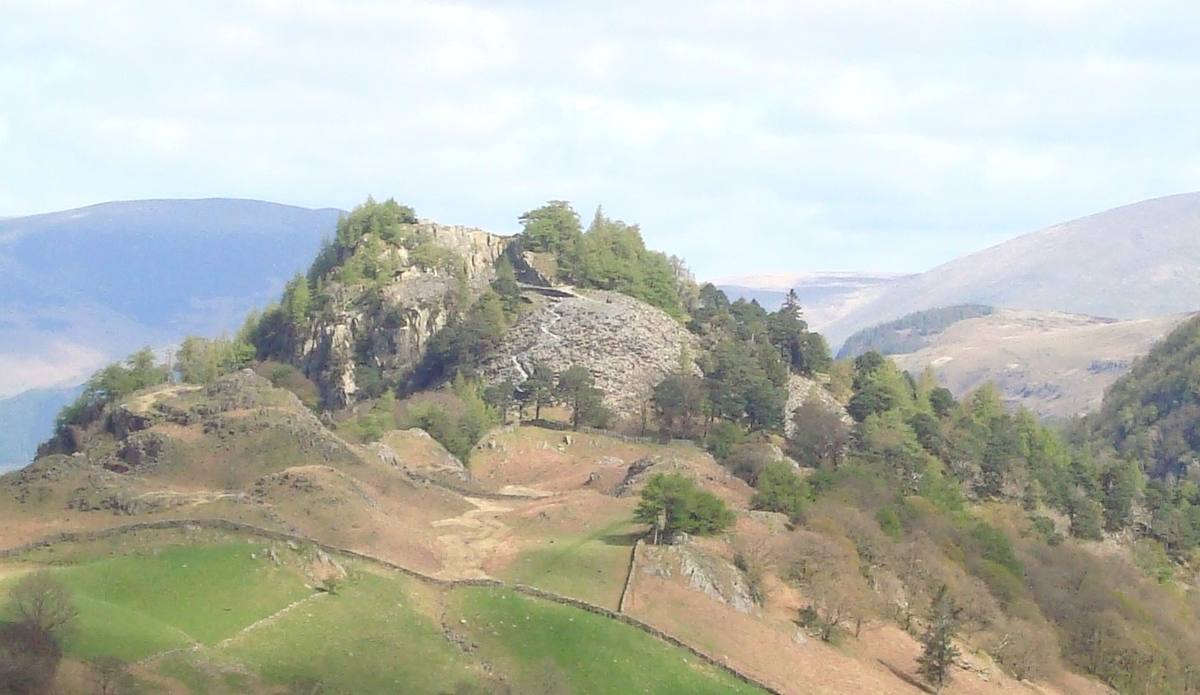 The wooded knoll of Castle Crag standing in the jaws of Borrowdale