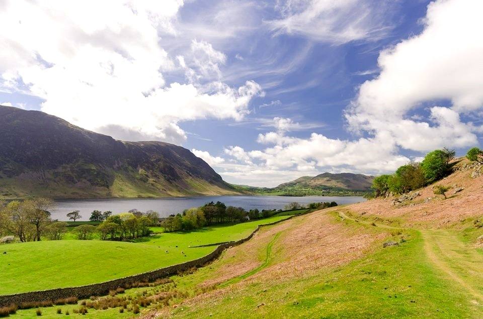 Crummock Water below a bracken slope with the high fells beyond