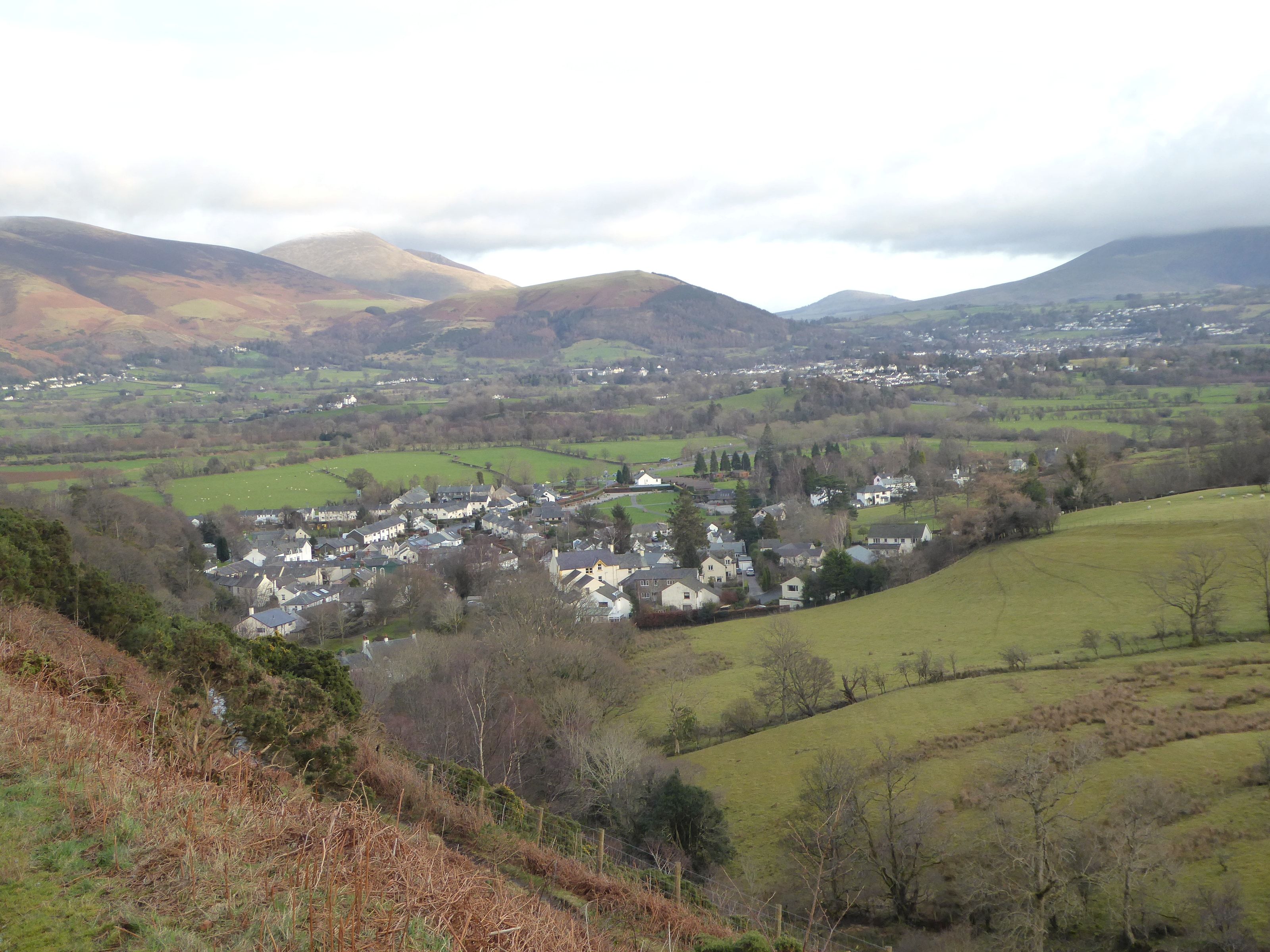 Keswick and the vale seen from the fellside with cloud shadow moving across