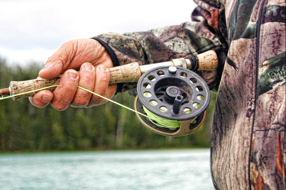 Close up of fishermans reel and rod
