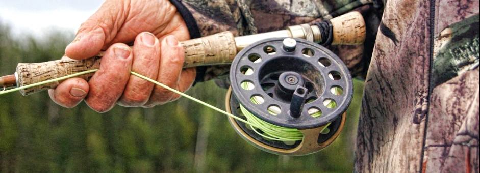 Close up of fishermans reel and rod