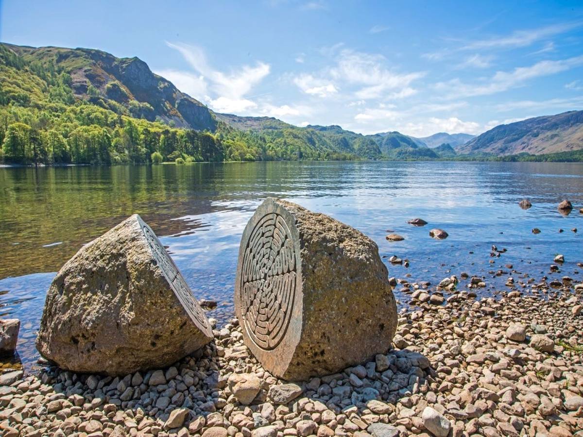 The carved spiral stone sculpture on the shingle at Calf Close Bay
