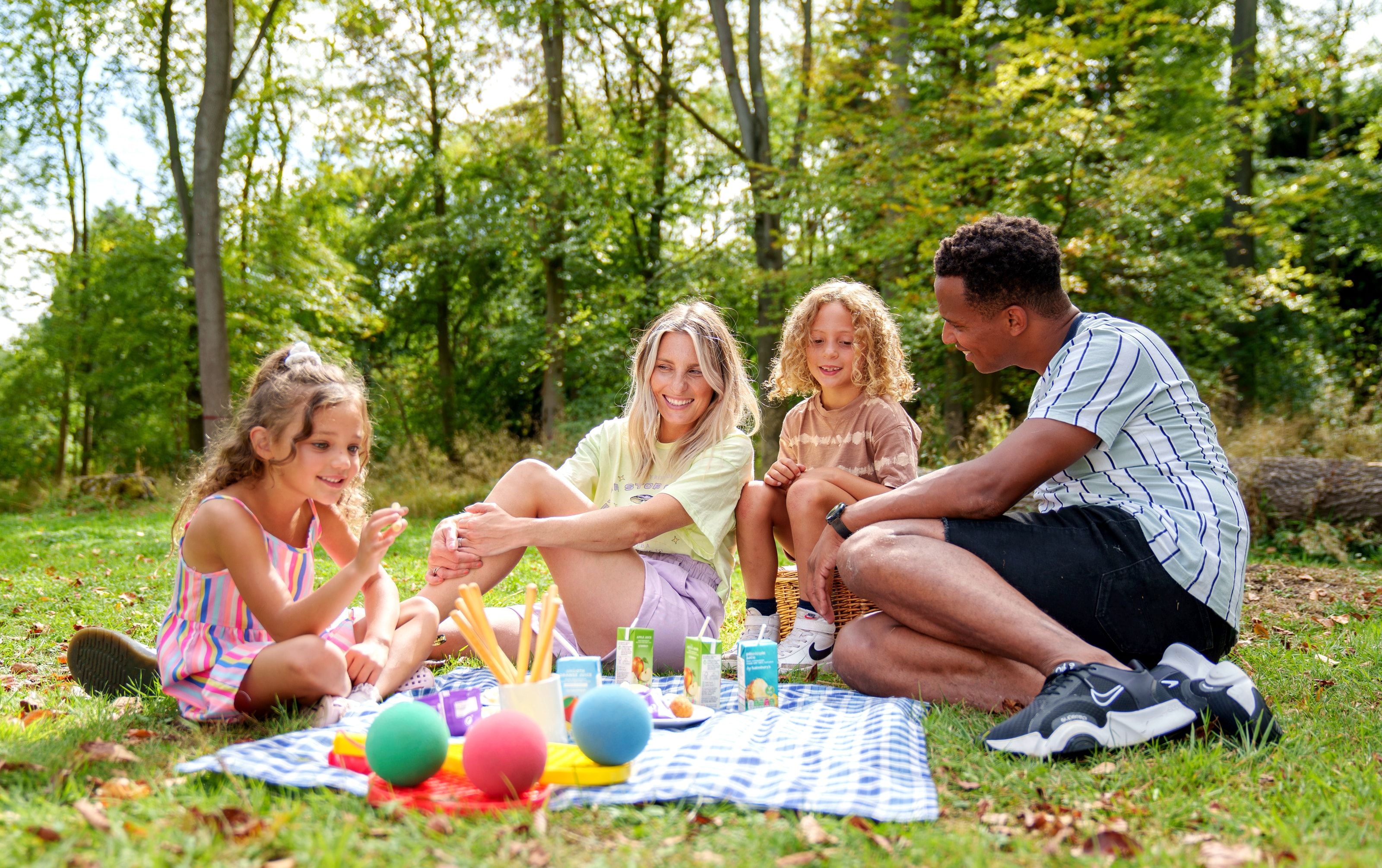 Family enjoying a picnic in the forest