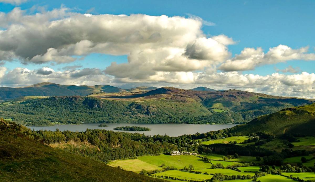 Derwentwater and the wooded vale seen from high on Barrow under piled cloud
