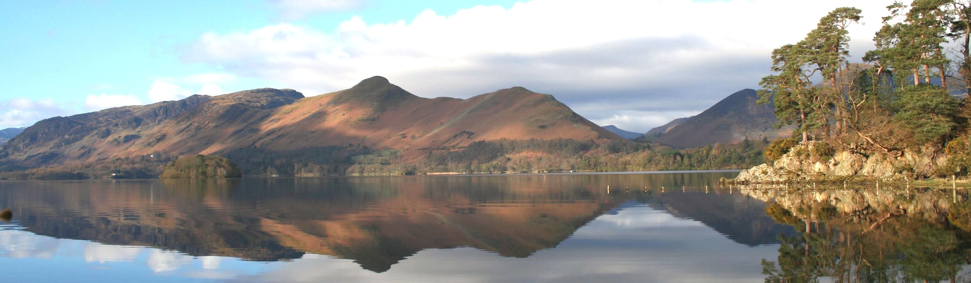 Derwentwater lying still with the fells reflected seen from Friars Crag
