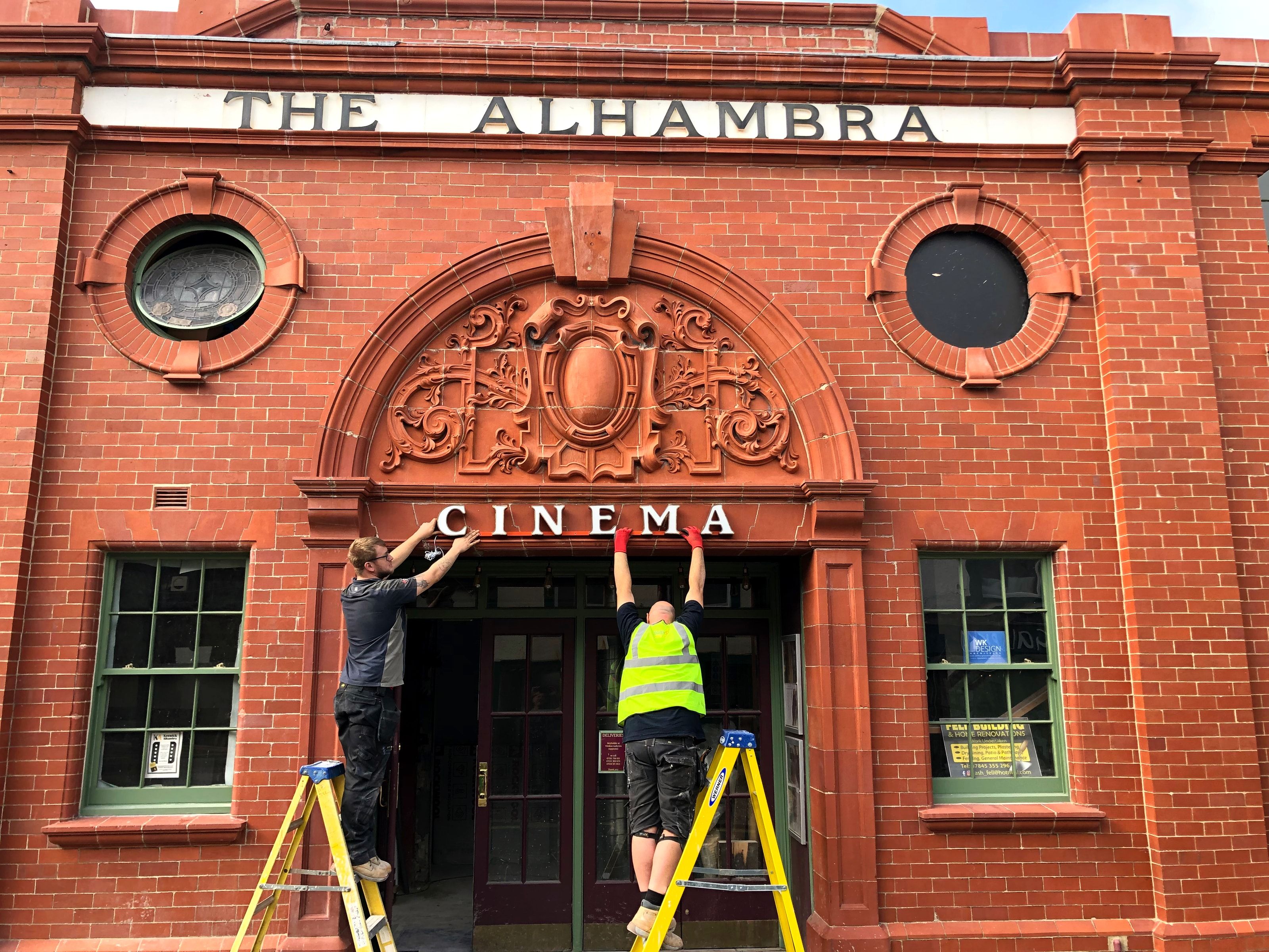 Cinema signage being reinstated on th front of the building