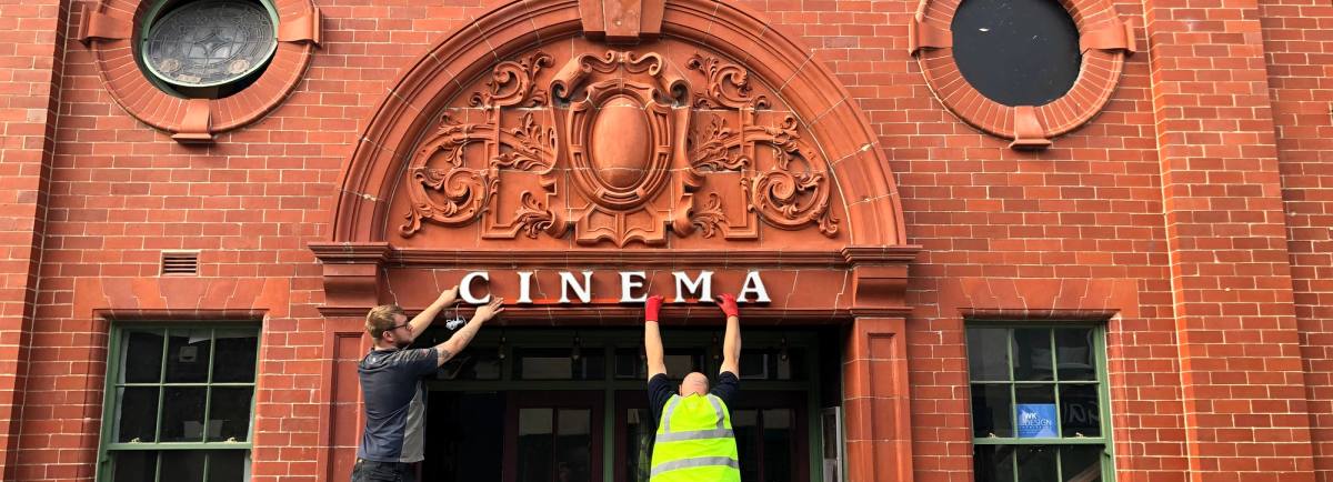 Cinema signage being reinstated on th front of the building