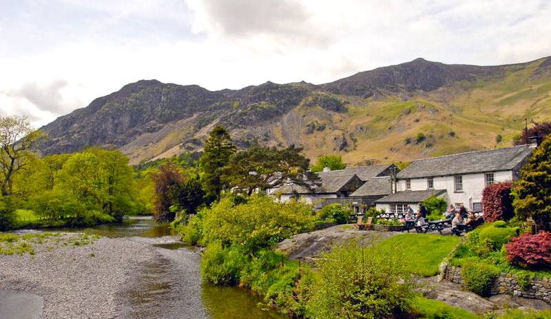The river running past the cottages and gardens of Grange in Borrowdale