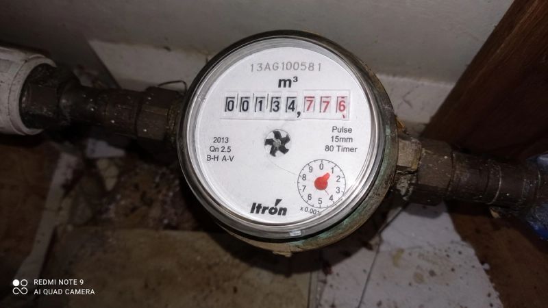 Itron water meter mid-reading in a UK home, checked during a leak investigation