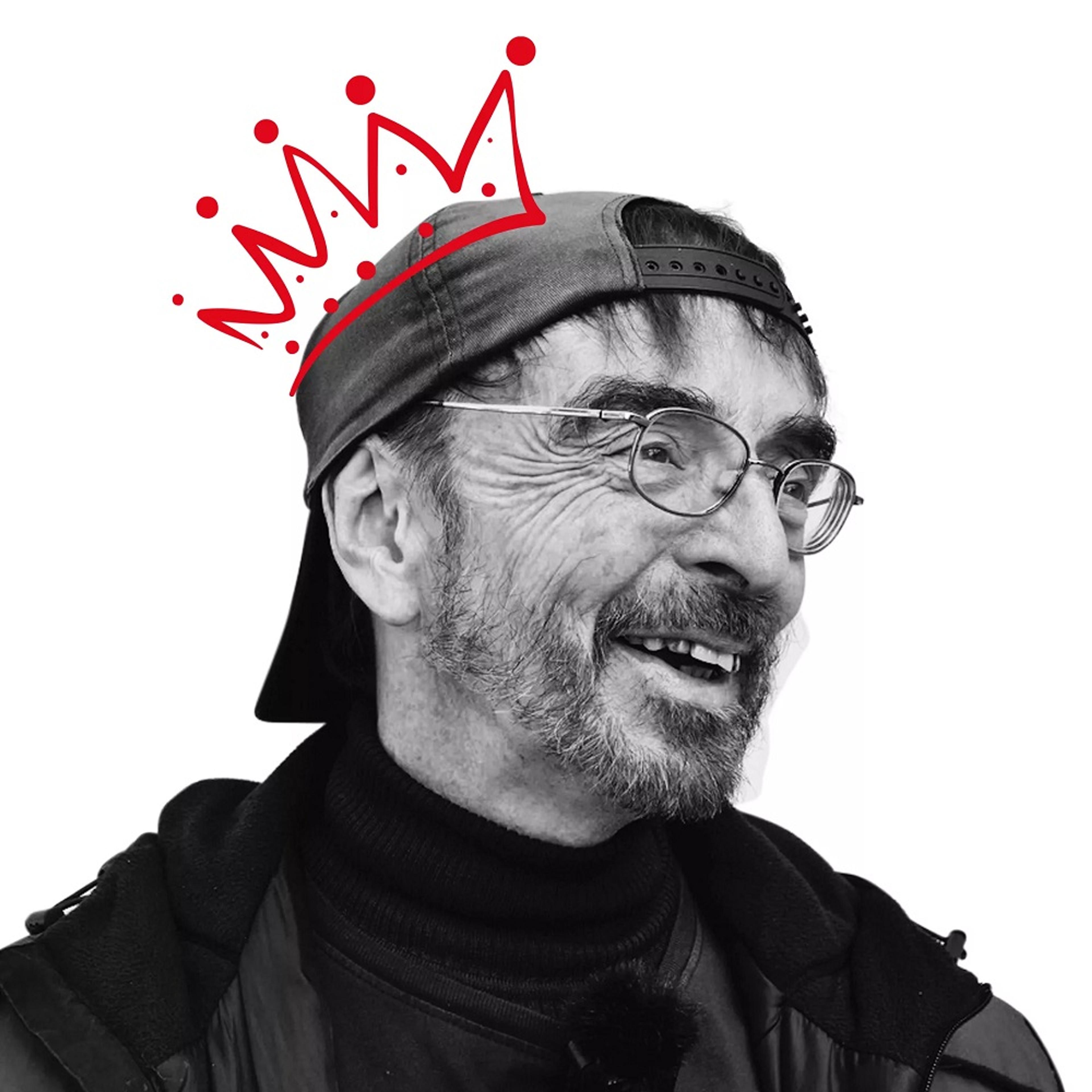 Black and white photo of man with red crown