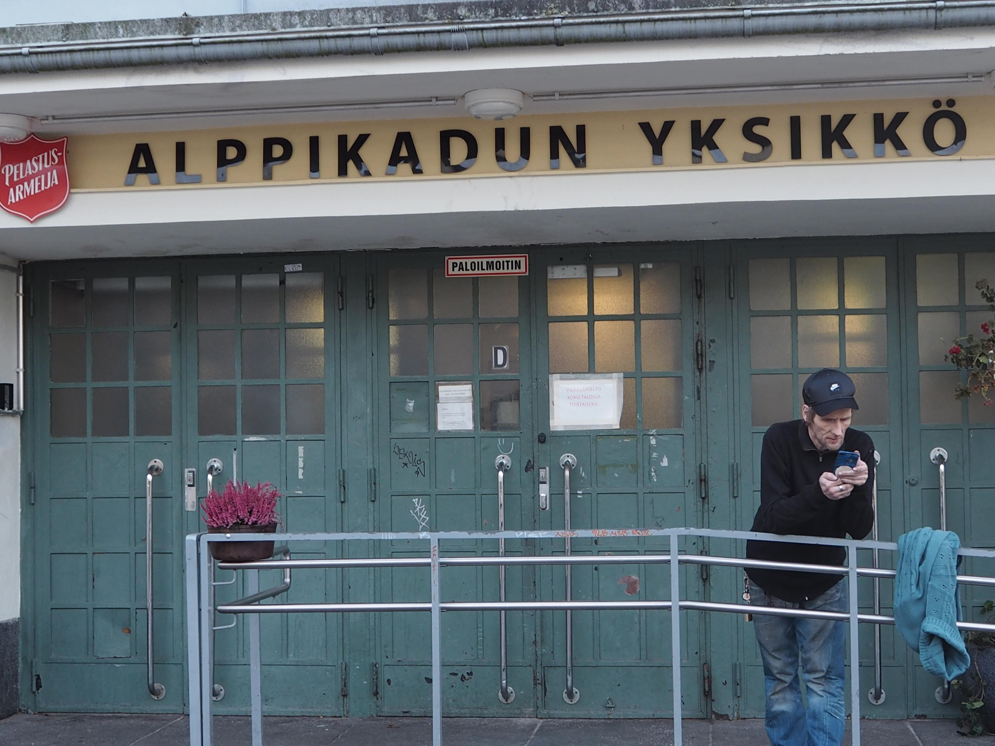 Jarkko “Jake” Jalonen defies the cold weather, checks the pictures on his phone