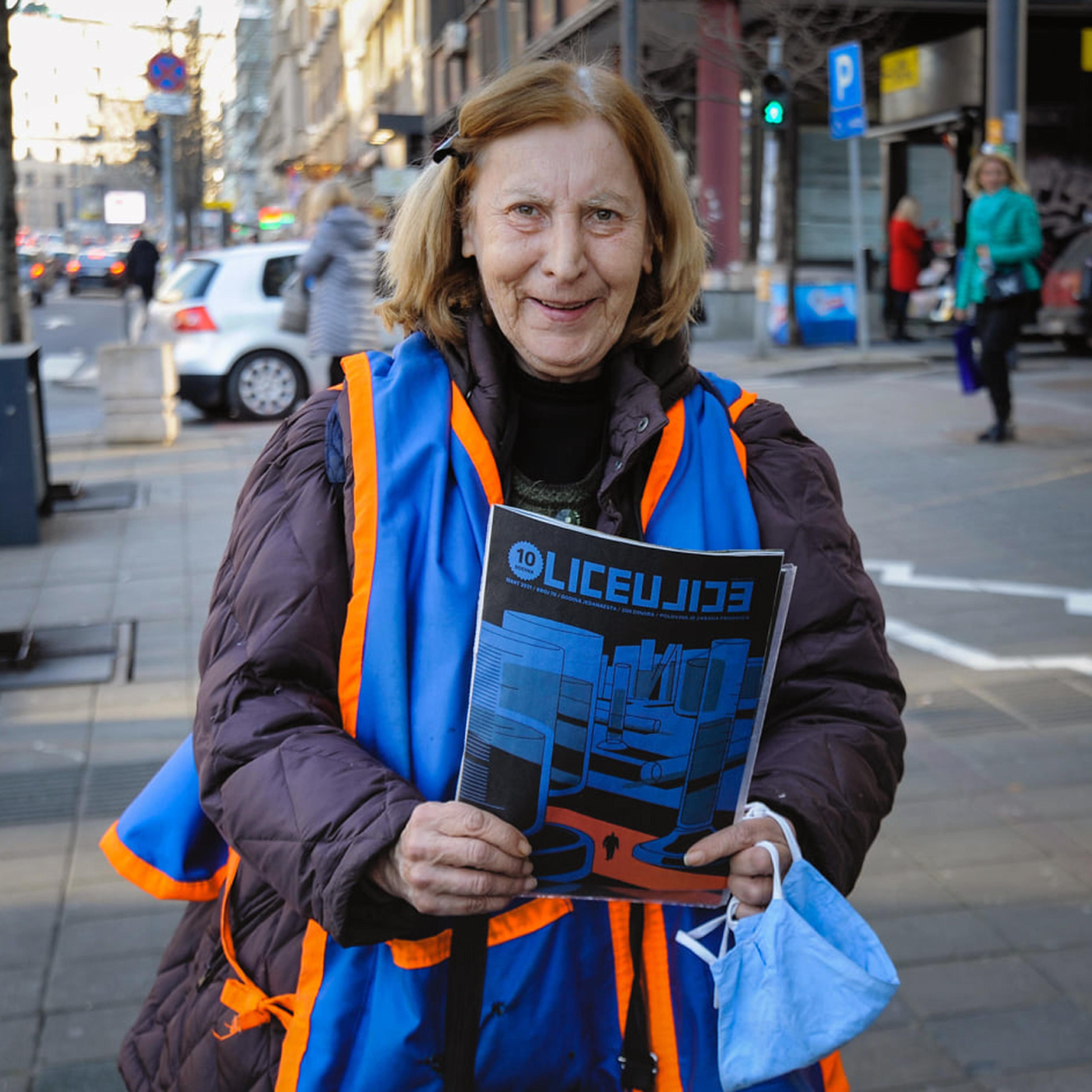 Woman holding Lice u Lice magazine