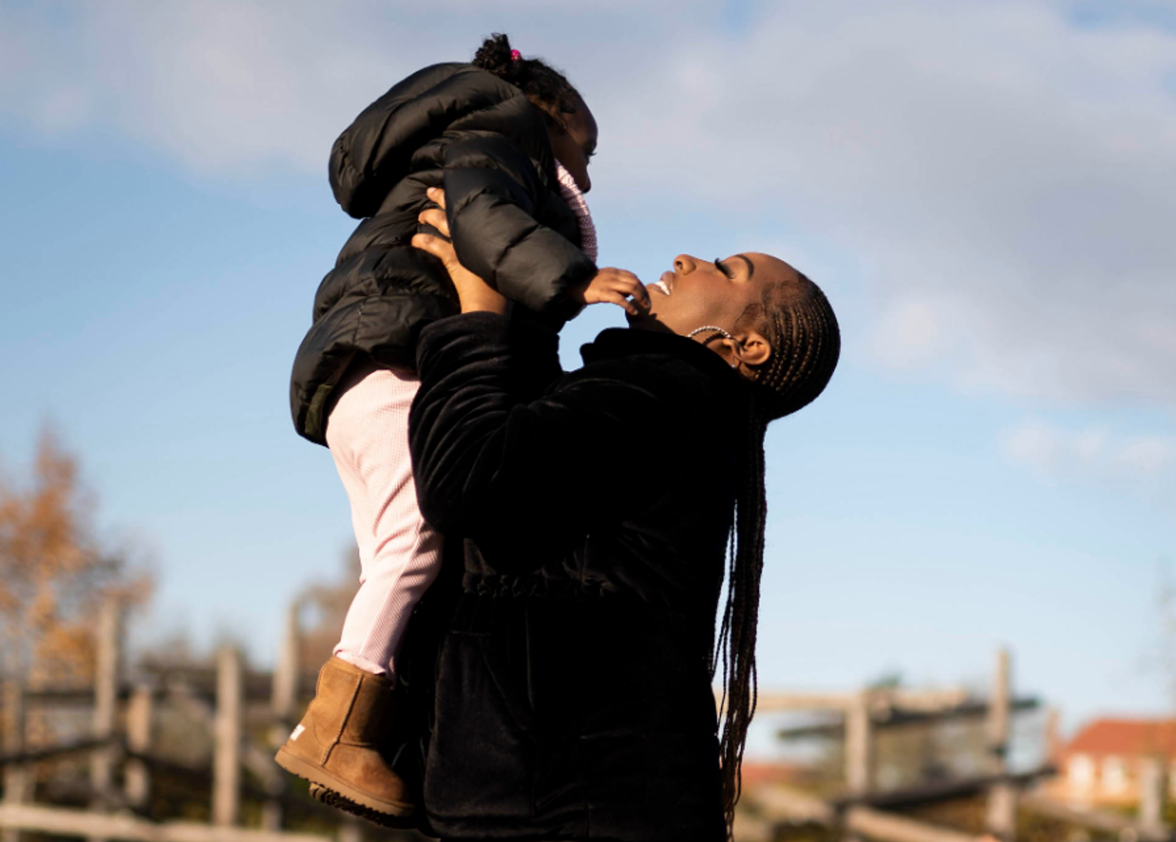 image of woman holding child