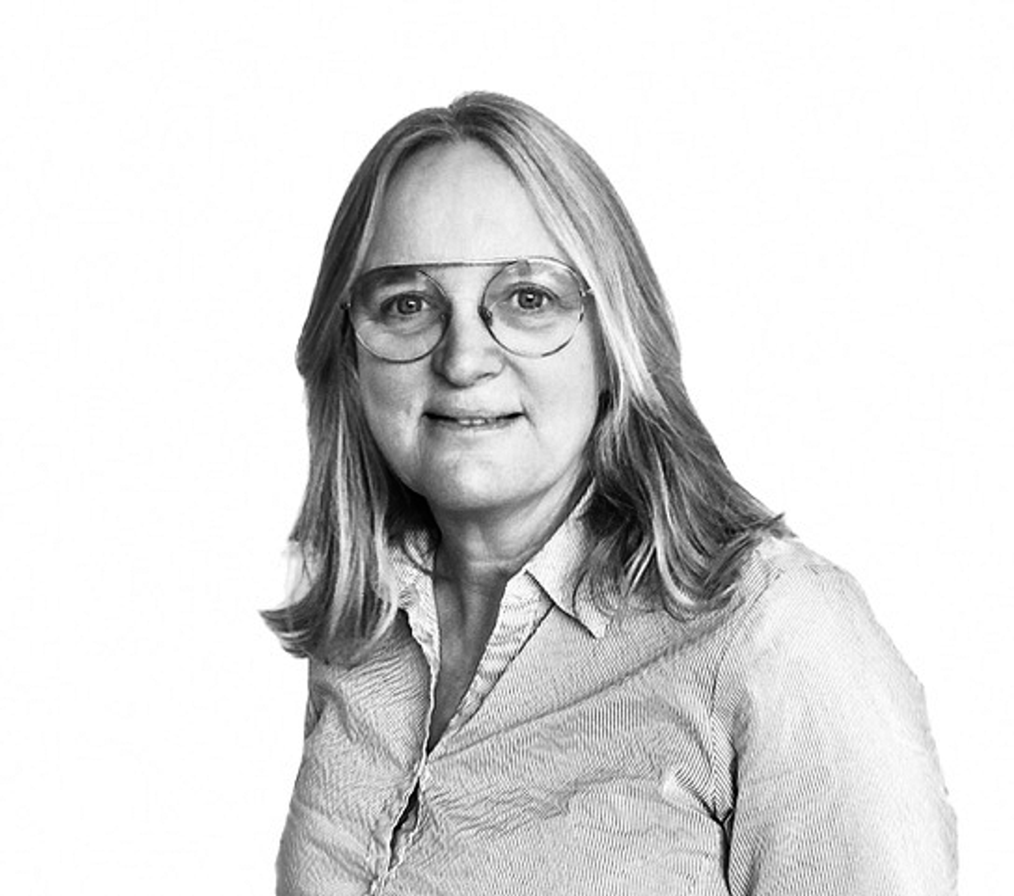 a black and white photo of a woman wearing glasses