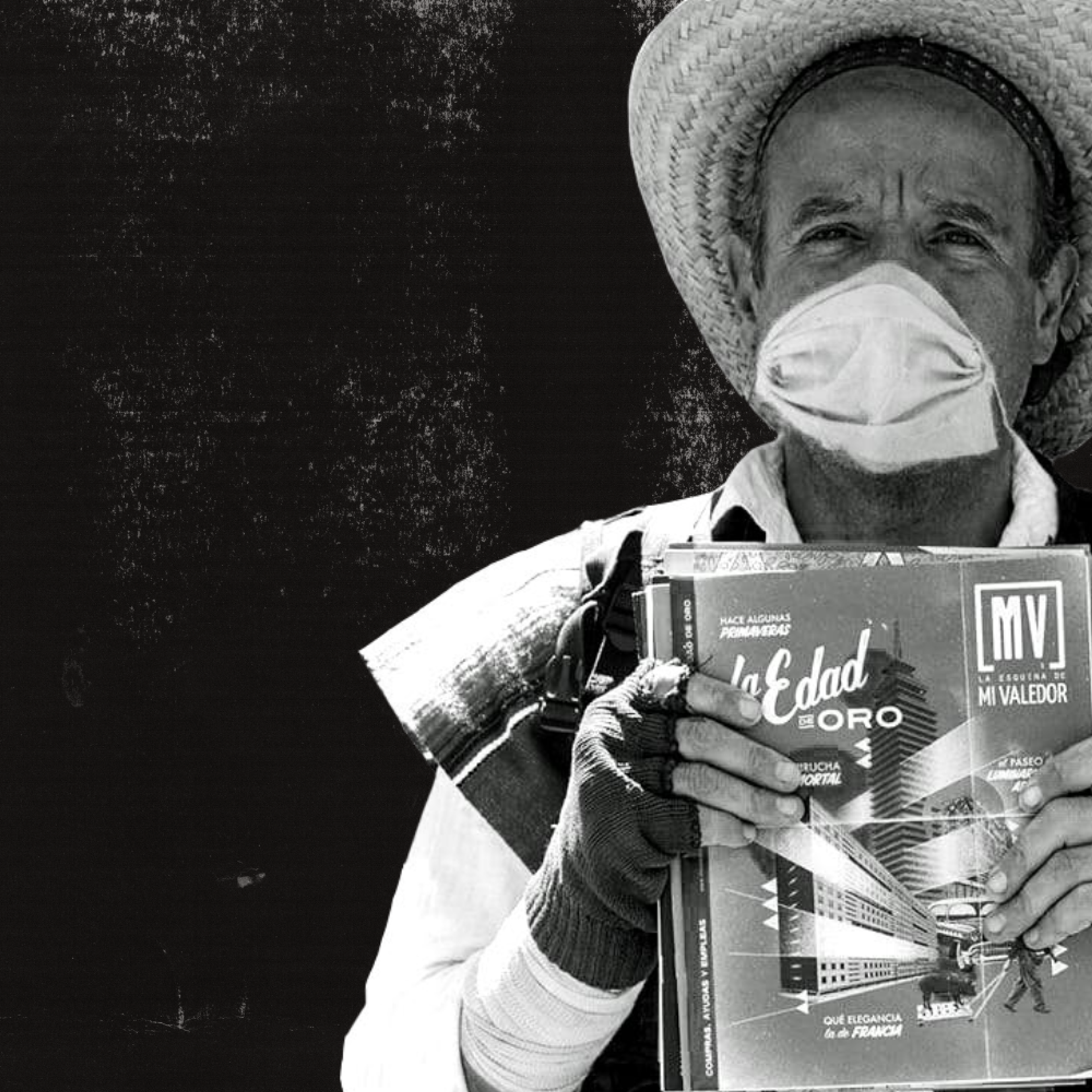 A man holding up a Mi Valedor street paper