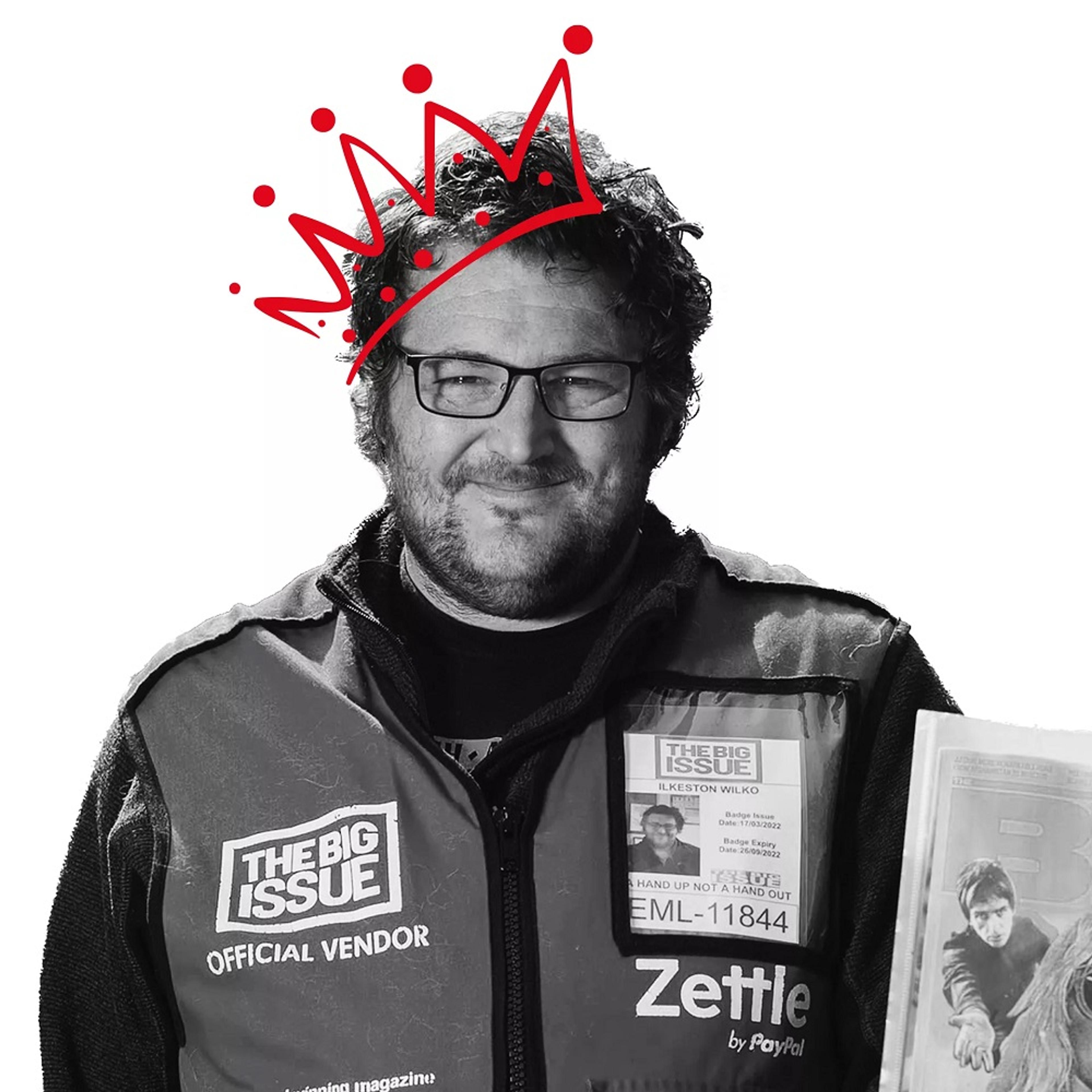 Black and white image of man with red crown