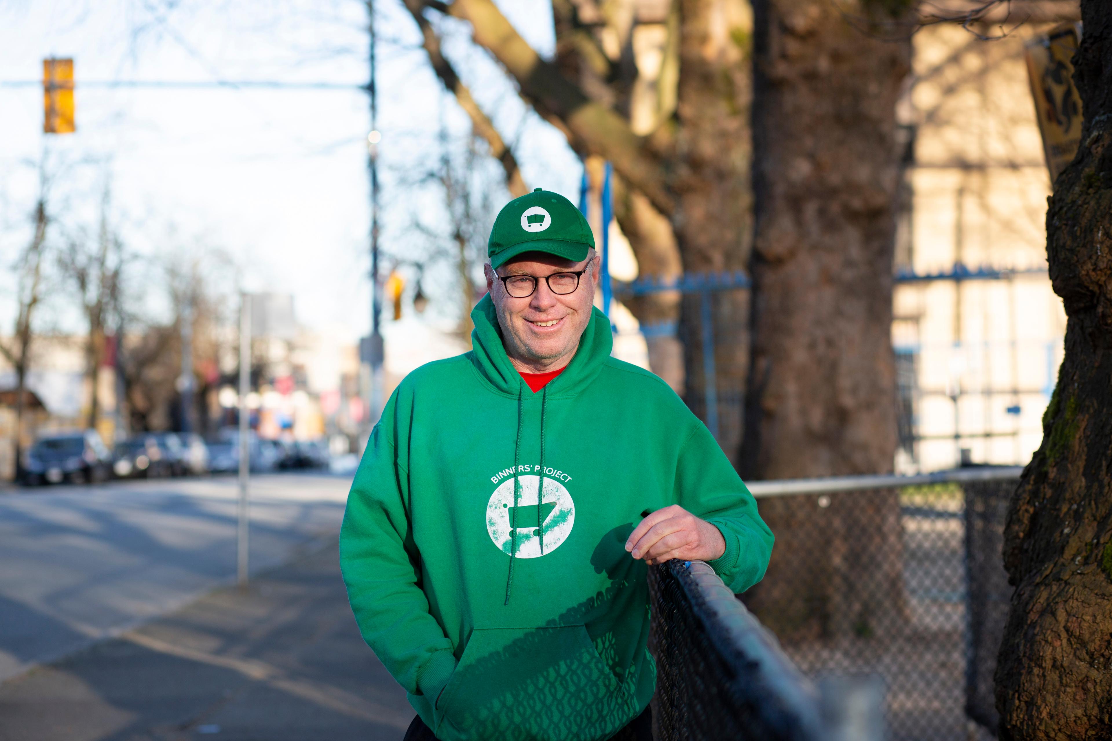 Man in green hat and jumper