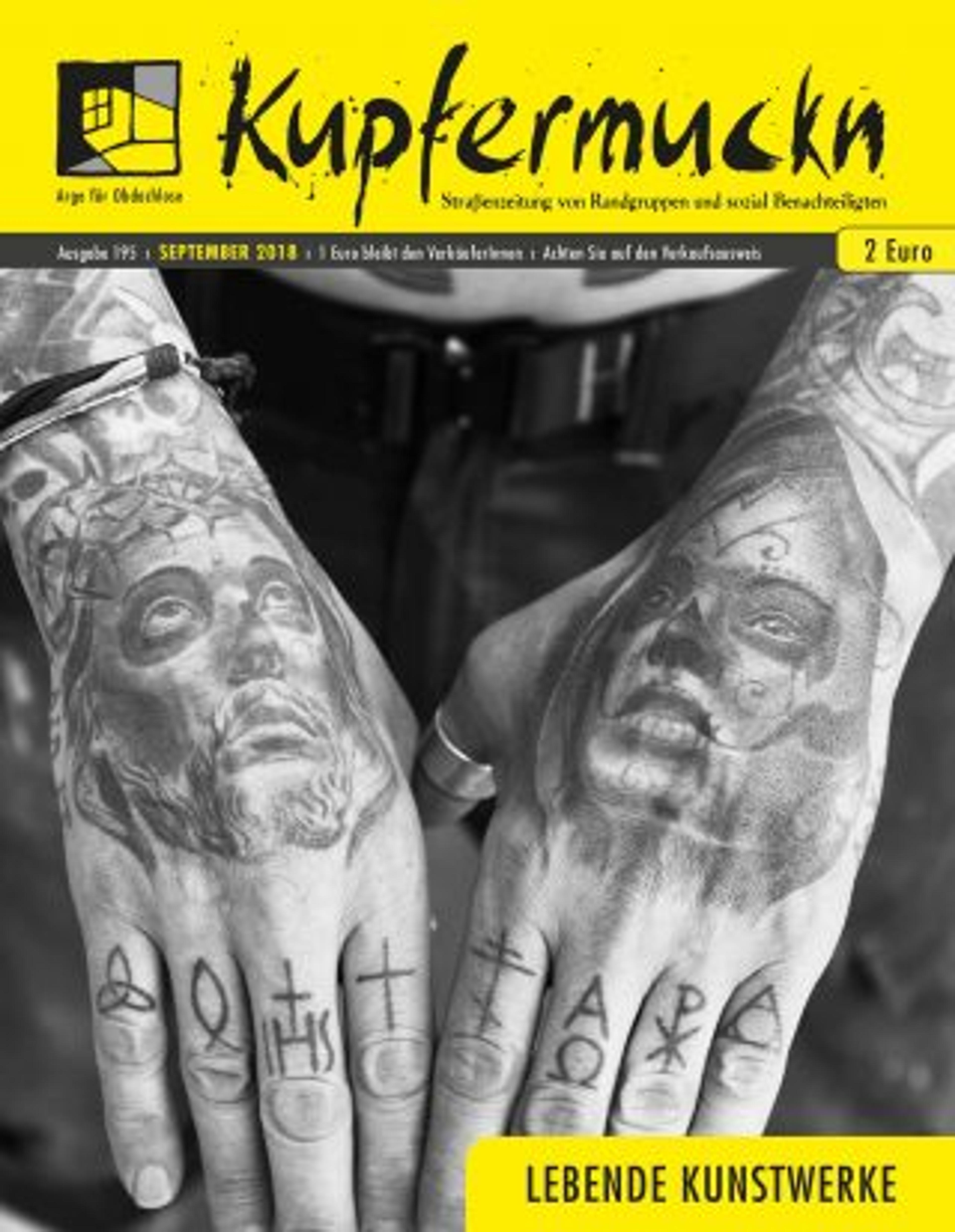 Front Cover of Kupfermuckn street paper - black and white image of hands with tattoos 