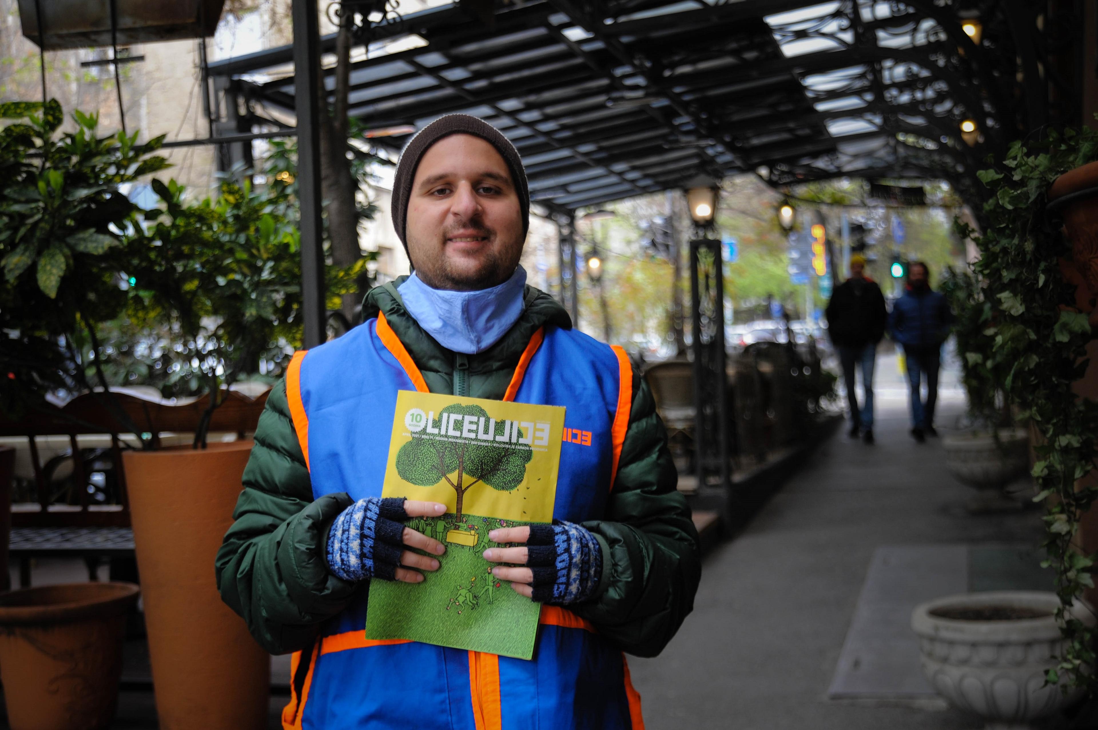 Man holding magazines