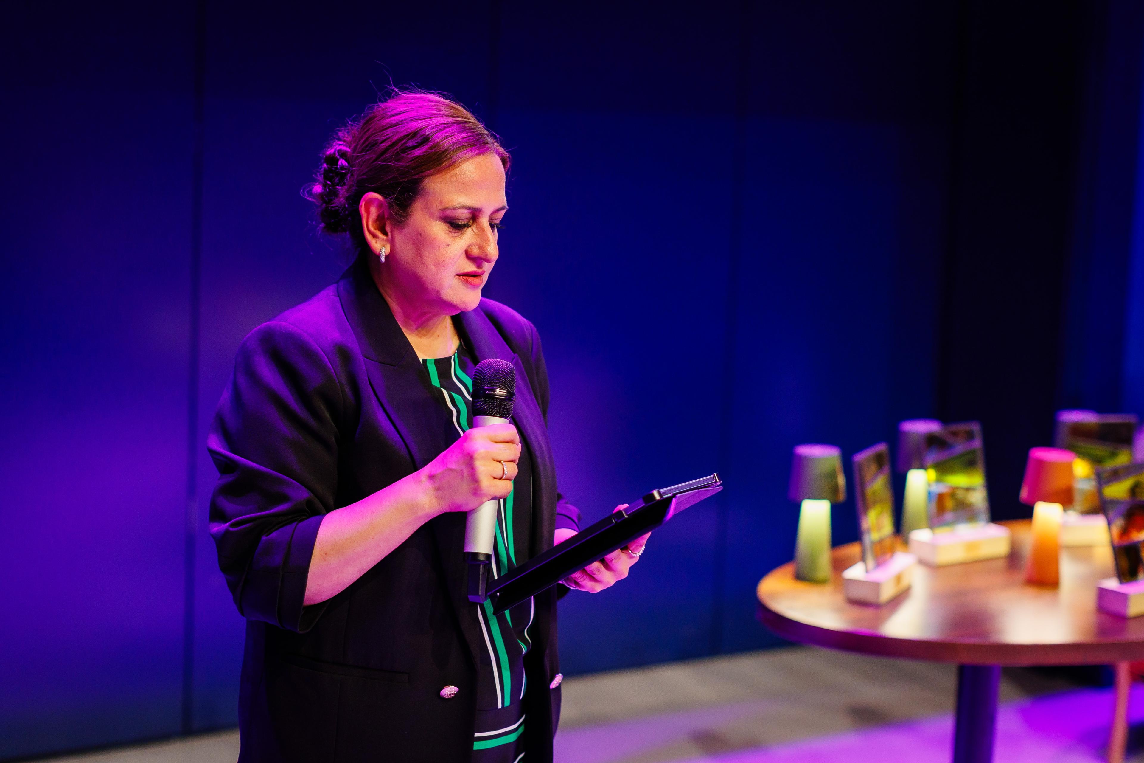 1. Ambreen Bonnet reading ‘One Voice, One Night’ at the INSP Awards 2026 in Glasgow