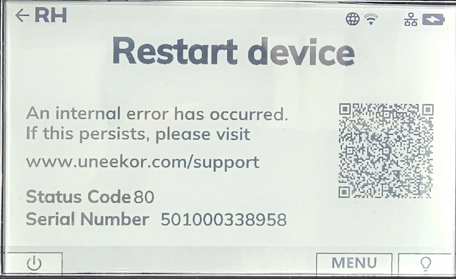 Digital display showing error message: "Restart device", "An internal error has occurred. If this persists, please visit www.uneekor.com/support", Status Code 80, Serial Number 501000338958, and a QR code.