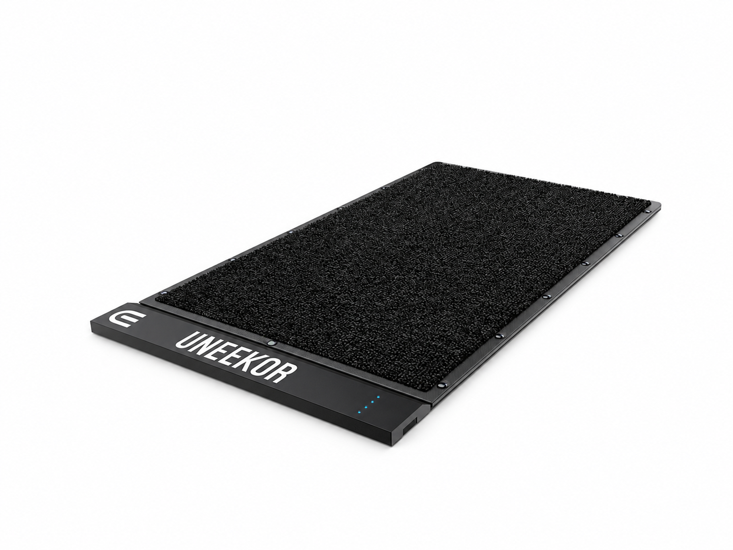 Black Uneekor golf simulator mat with textured surface and blue lights.