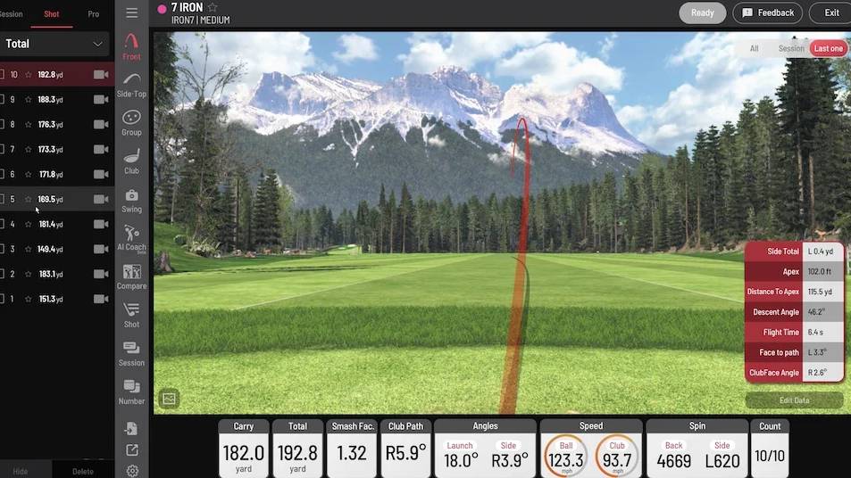 Golf simulator screen displaying a shot trajectory over a scenic golf course with detailed performance metrics.