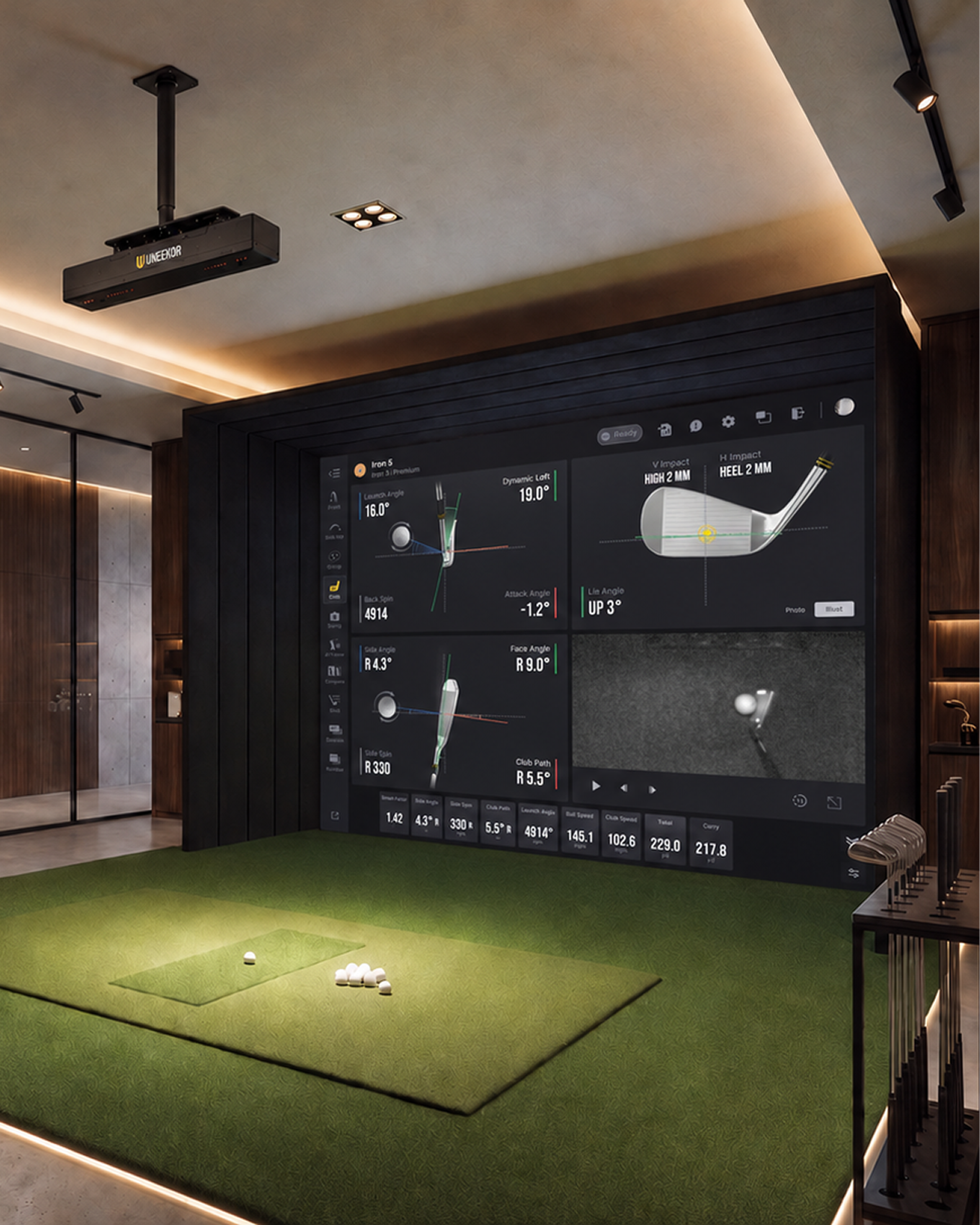 An indoor golf simulator with a large screen displaying swing data, a projector, artificial turf, and golf clubs.
