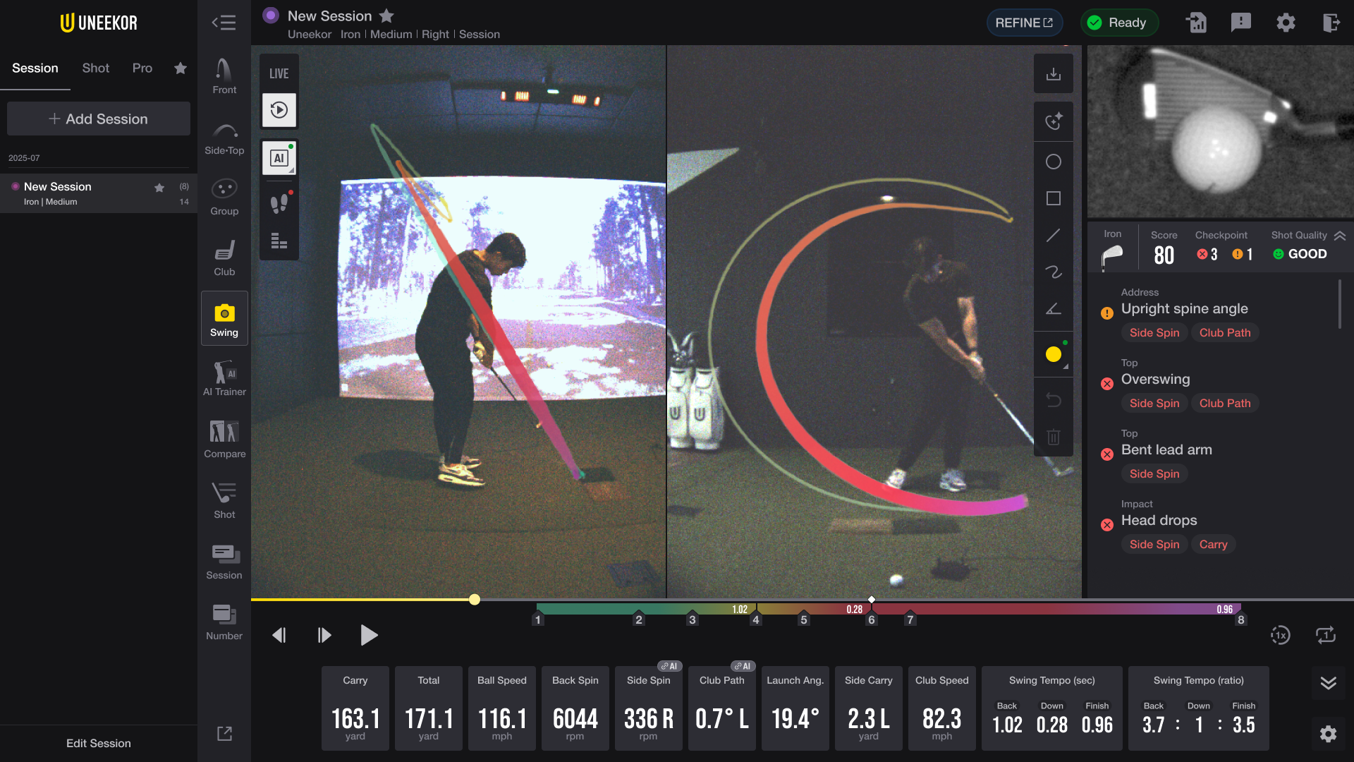 Golf simulator screen displaying a golfer's swing with visual path analysis, fault feedback, and performance data.