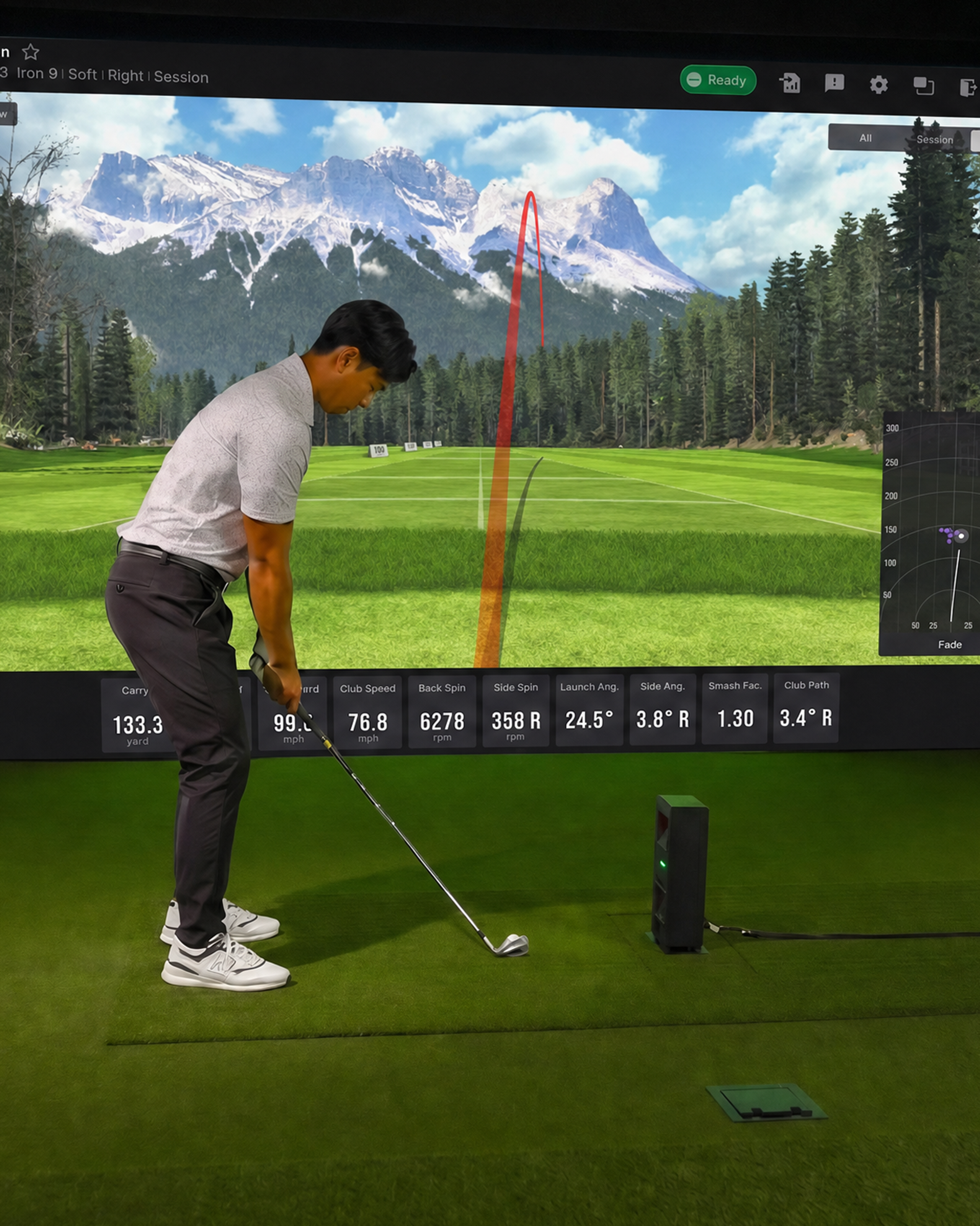 Man in a golf stance on a simulator with a virtual course displaying shot data.
