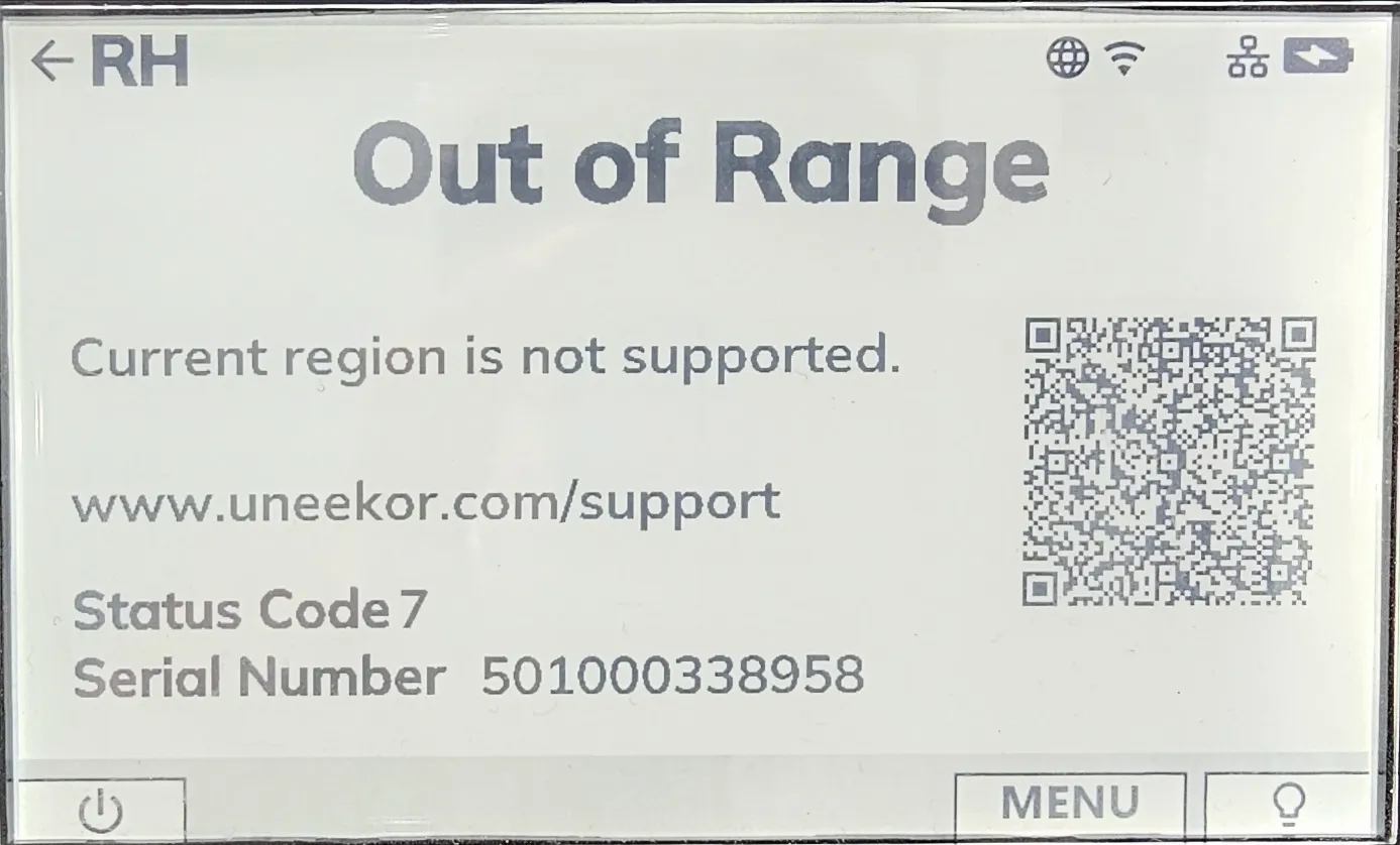Uneekor device screen displaying an "Out of Range" error message for an unsupported region, with a QR code and support information.