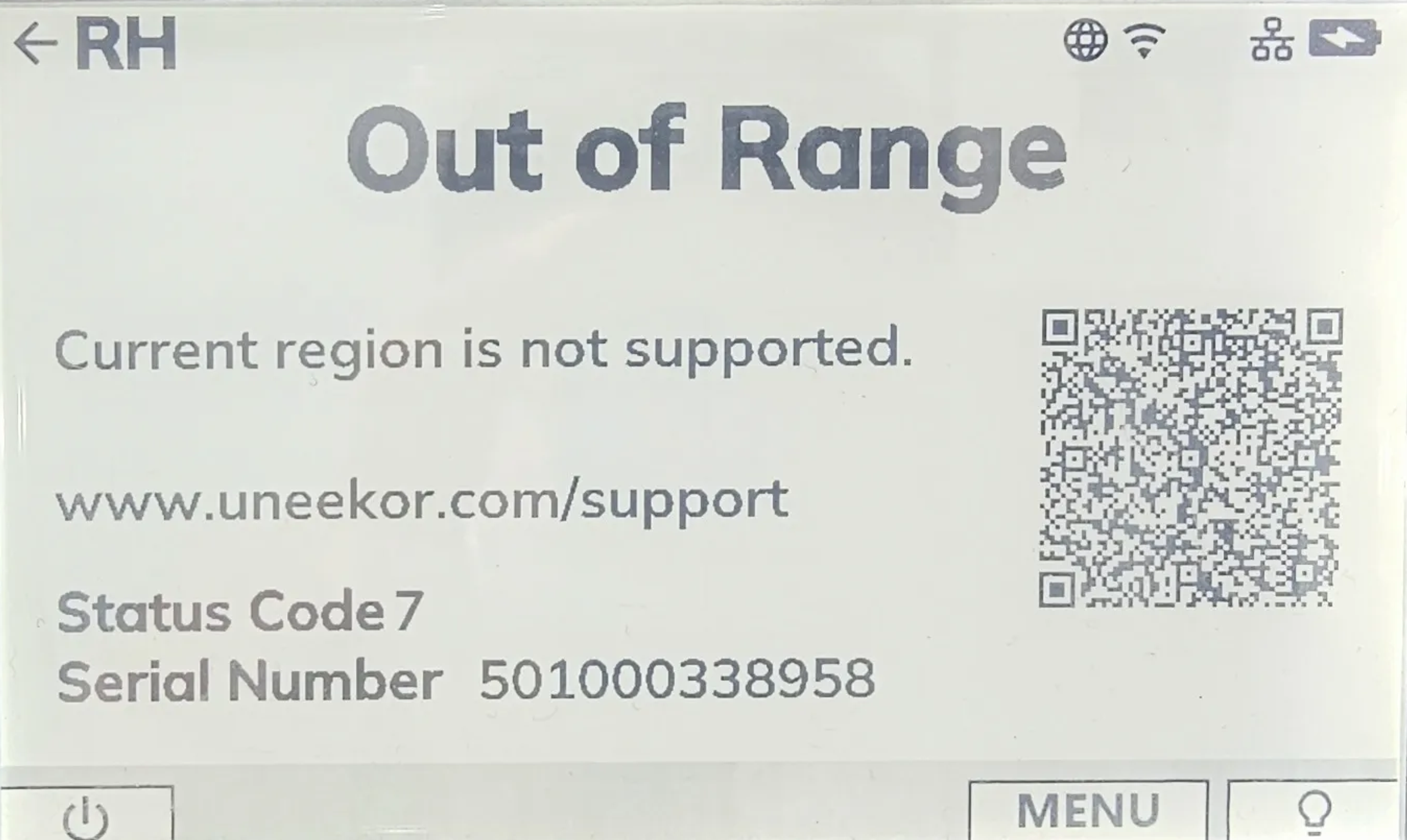 Uneekor device screen displaying an "Out of Range" error message for an unsupported region, with a QR code and support information.