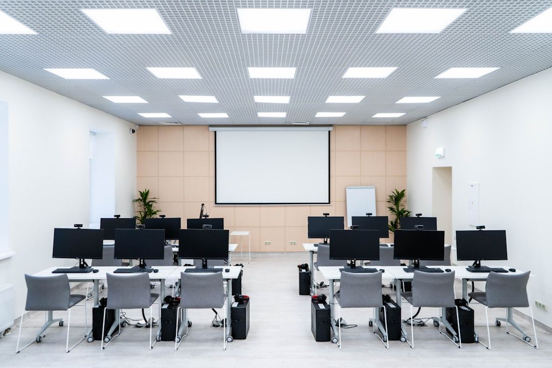 a room filled with lots of desks and computers