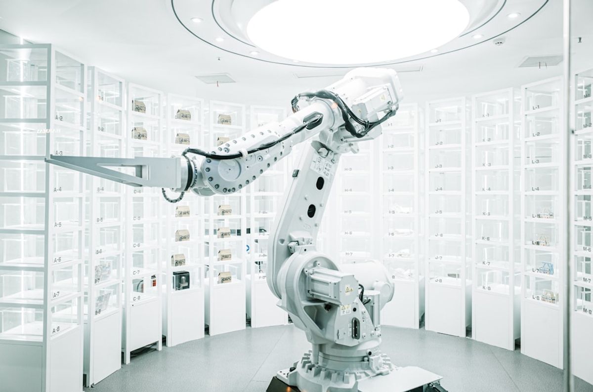 white robotic arm in display showroom