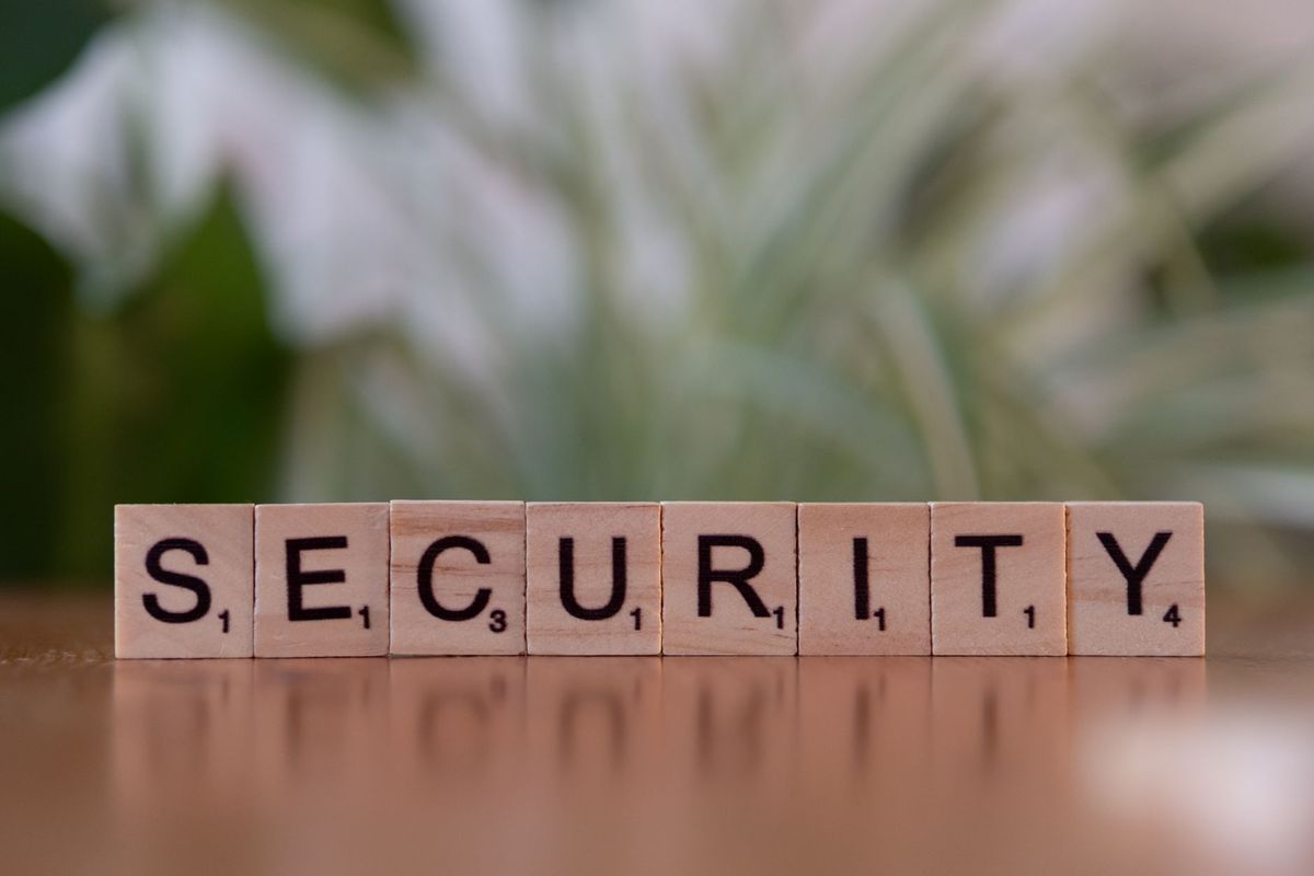 Close-up of wooden Scrabble tiles spelling SECURITY, symbolizing cybersecurity and protection.