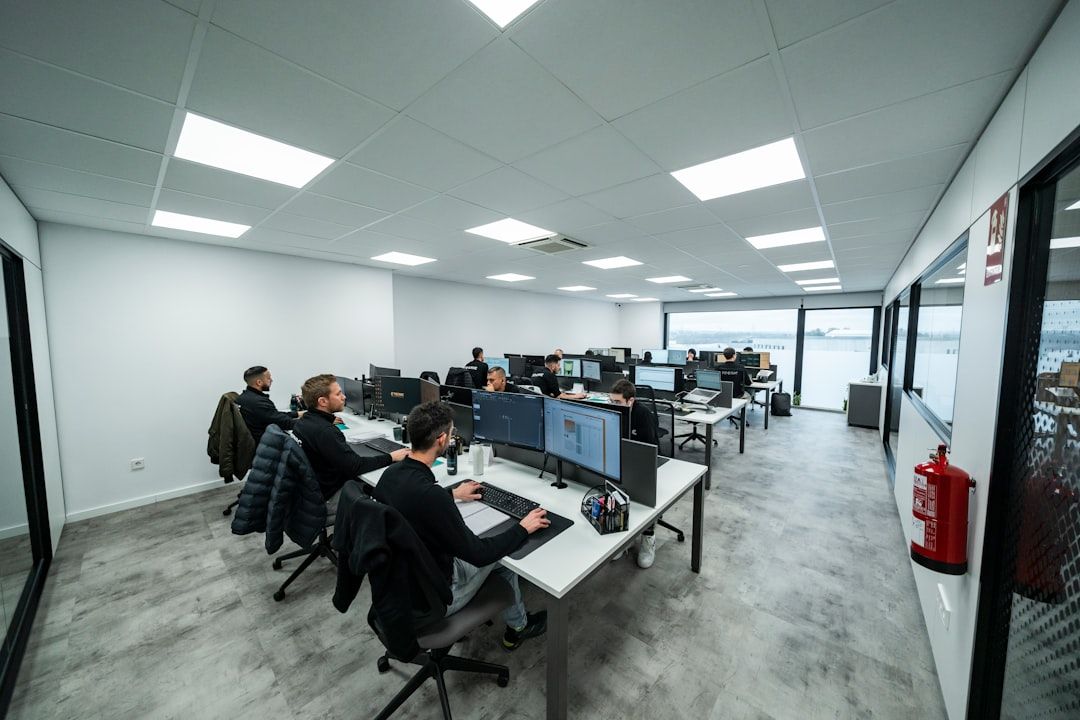 Office workers are busy working on computers.