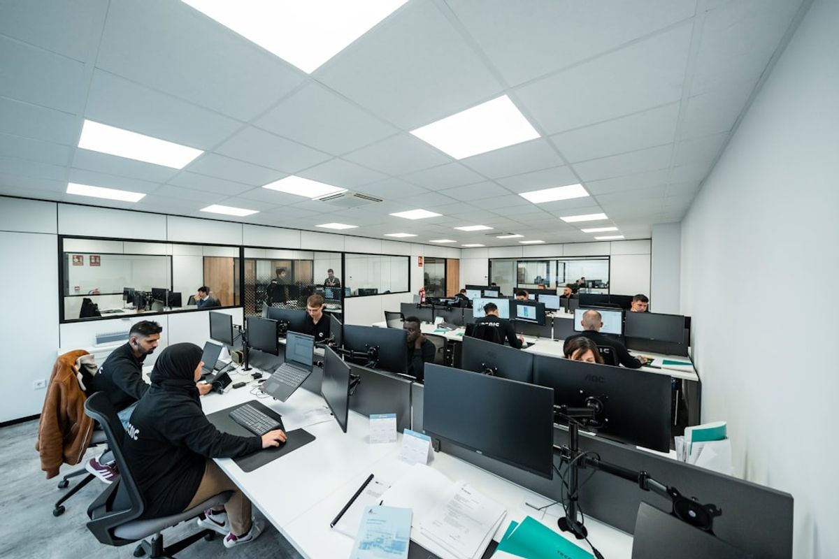 Office workers are busy working on computers.