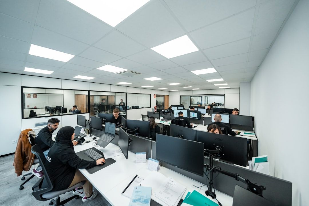 Office workers are busy working on computers.