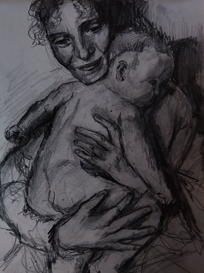 A mother holding her baby