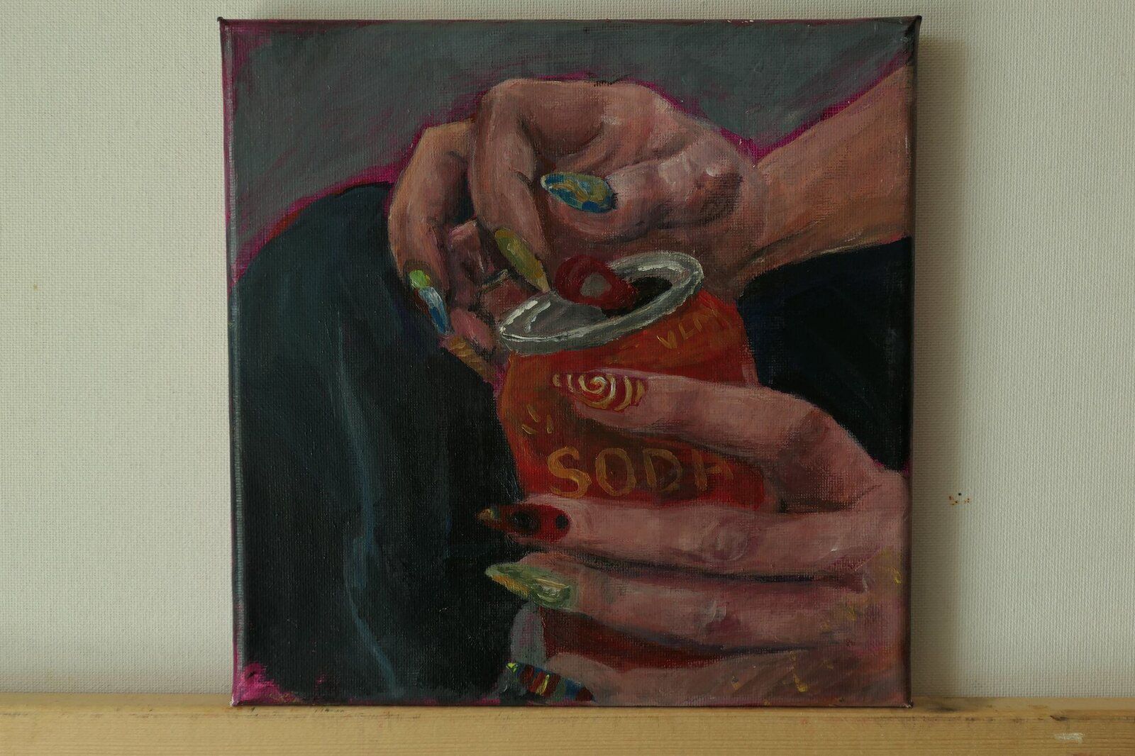 Hands holding a can of Soda