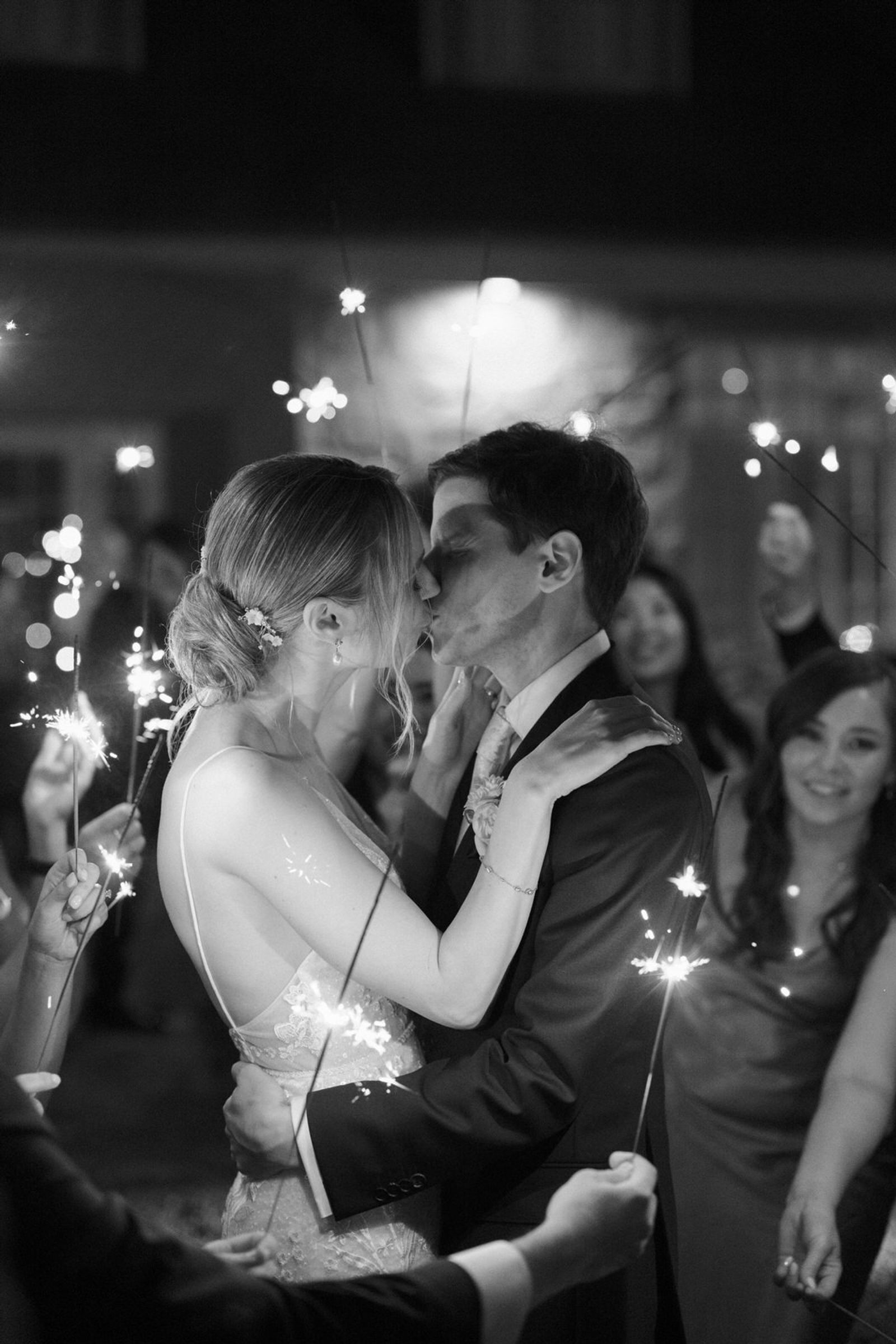 Bride and groom kissing during the wedding party, London ontario wedding photographer