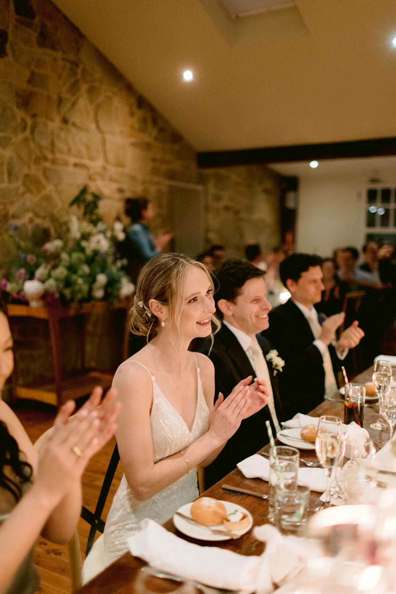 Bride clapping for speech during the reception, London ontario wedding photography