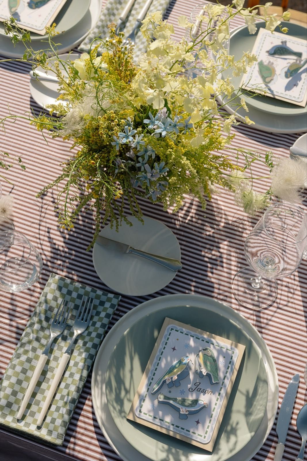 Root Beer Ticking Stripe paired with Loden Pixel Napkins at a wedding reception in the Vinyards of California