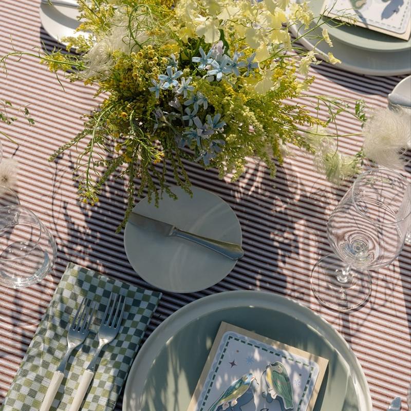 Root Beer Ticking Stripe paired with Loden Pixel Napkins at a wedding reception in the Vinyards of California