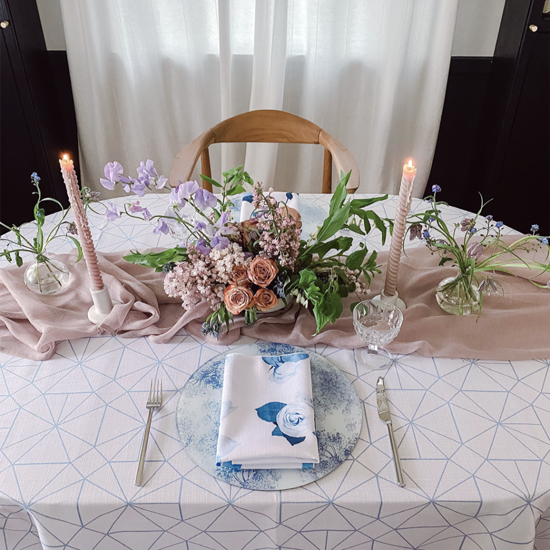Round table with elegant white and green table setting