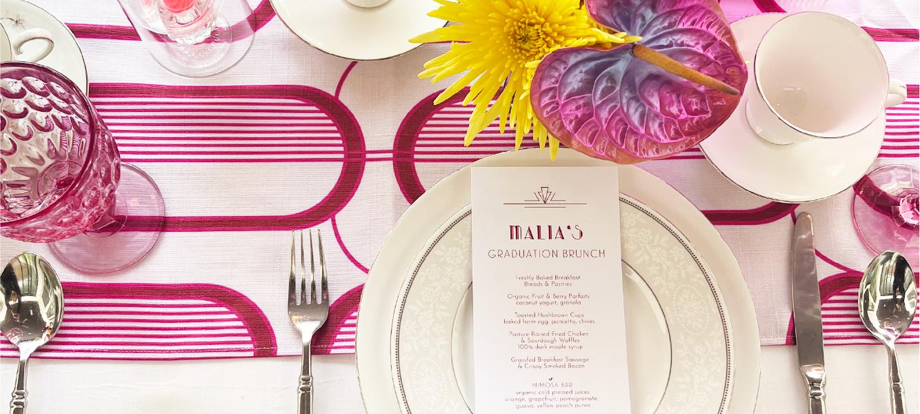 Pink tablescape with striped linens