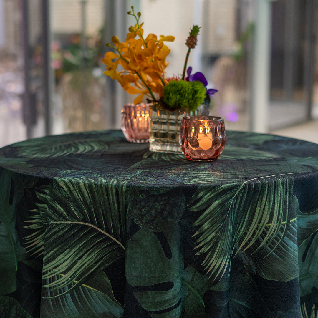Round table with tropical green setting
